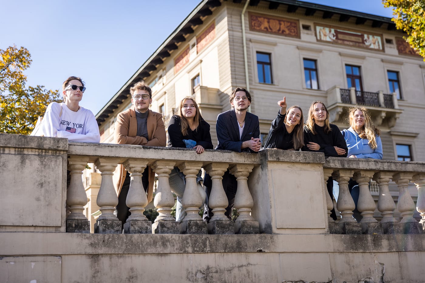 UNYP students standing on the terrace of a historic building in Prague on a sunny day.