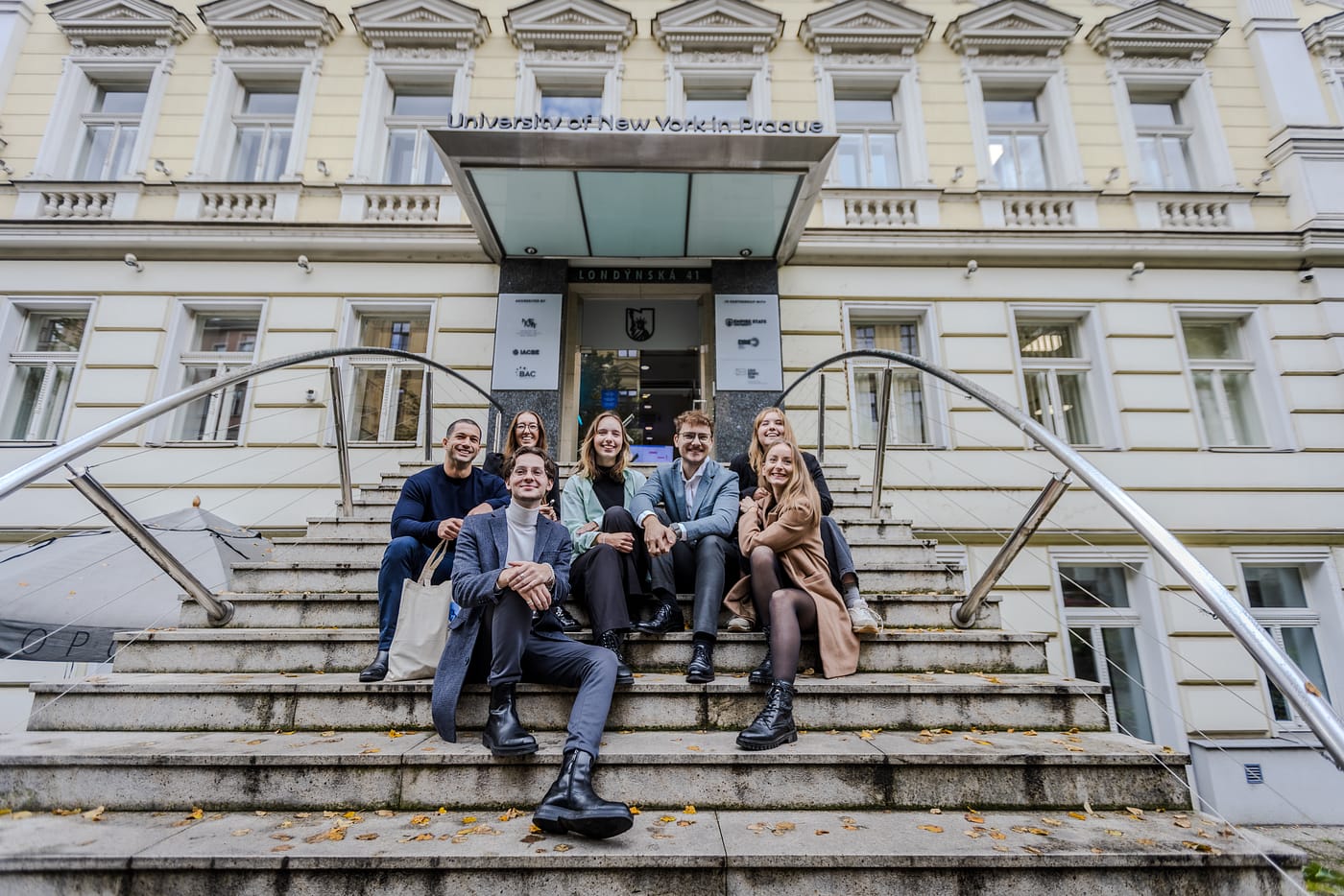 UNYP students pose for a photo at the entry to the main campus.
