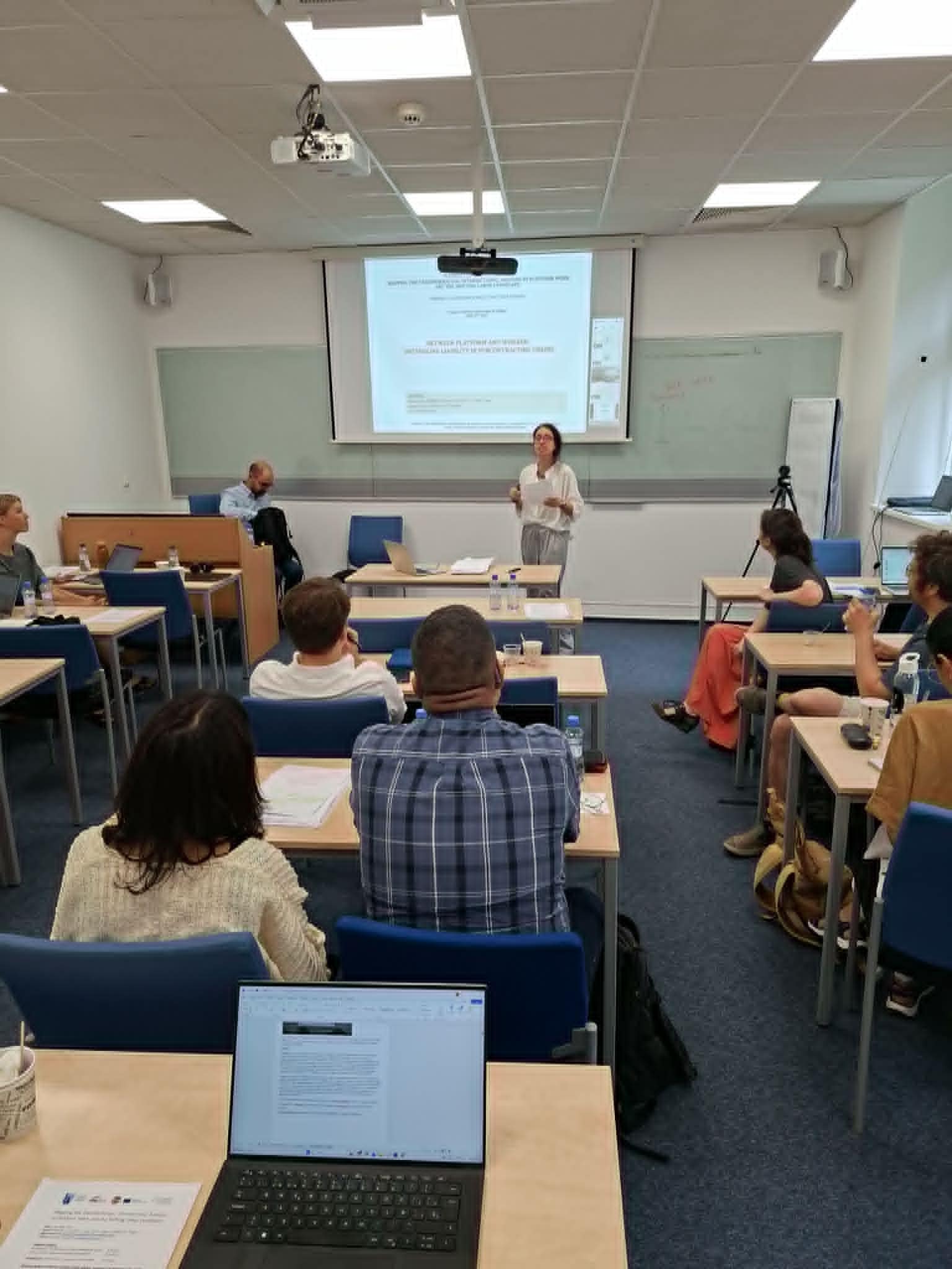 Participants listen to a keynote speaker at the Platform Work Europe conference taking place at UNYP in Prague