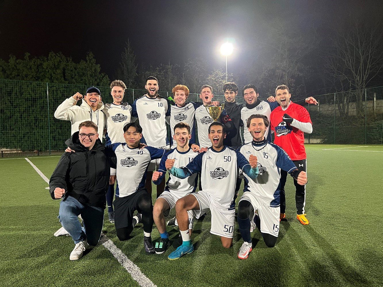 UNYP Blazers soccer team celebrate after winning a match