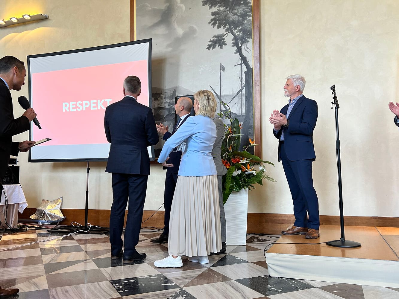 Czech President watches a presentation from the Winter Olympics at the Prague Castle