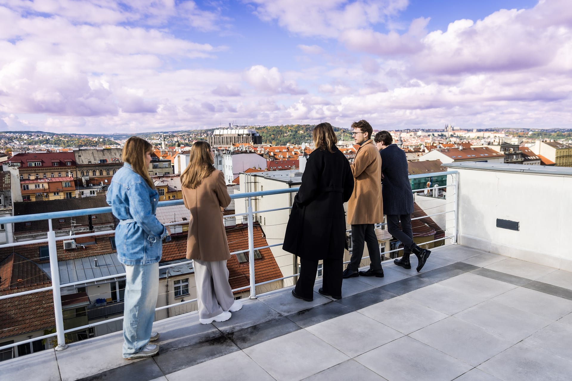 UNYP students survey Prague from the roof of the main campus building